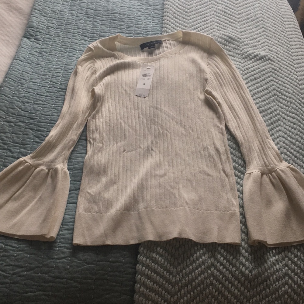 White sweater with bell sleeves